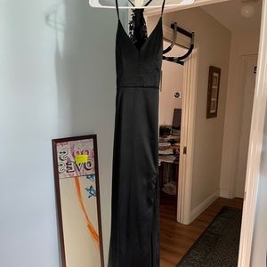 like new prom dress, black with detailed backing, worn once, has a slit